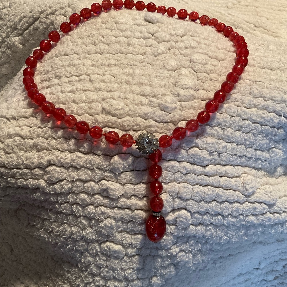 Red, sparkly glass bead necklace with rhinestone clasp.